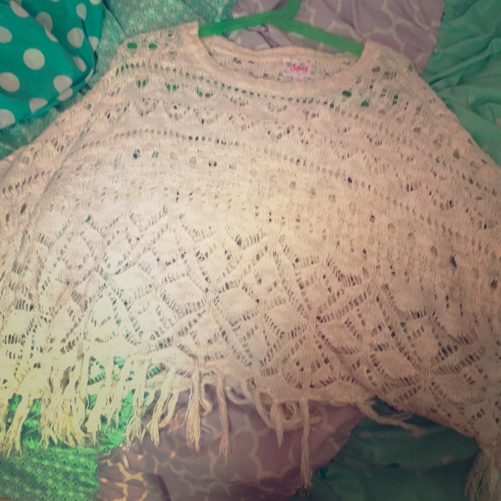 A white see through poncho from Justice